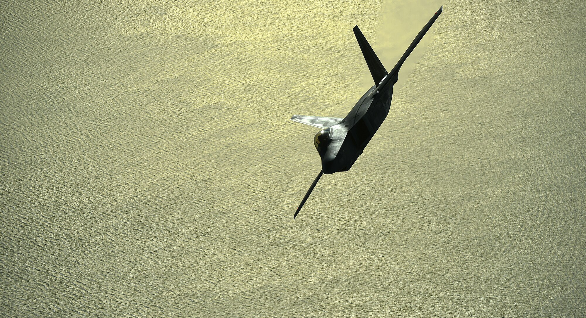 An F-22 assigned to the 380th Air Expeditionary Wing, Al Dhafra Air Base, United Arab Emirates receives fuel over the Arabian Peninsula from a KC-10 Extender, Nov. 29, 2017. The combination of stealth, integrated avionics and supercruise drastically shrinks surface-to-air missile engagement envelopes an minimizes enemy capabilities to track and engage the F-22.

 (U.S. Air Force photo by Tech. Sgt. Anthony Nelson Jr.)