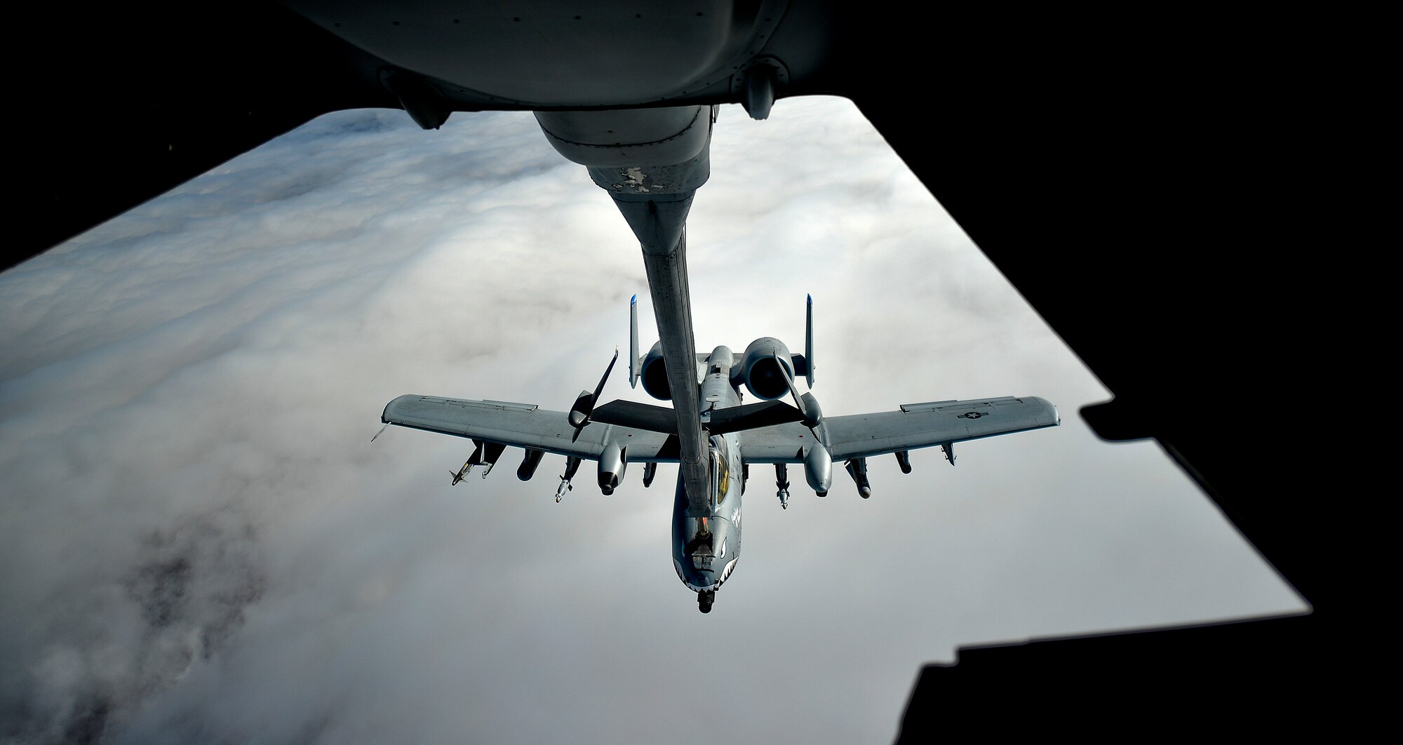 An U.S. Air Force A-10 Thunderbolt II pilot, currently assigned to the 332nd Air Expeditionary Wing, receives fuel over Iraq from a KC-10 Extender, Nov. 29, 2017. The A-10 has a wide combat radius and short takeoff and landing capability allowing for it to permit operations in and out of locations near front lines. 
 (U.S. Air Force photo by Tech. Sgt. Anthony Nelson Jr.)