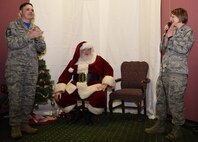 Lt. Col. Renee Thuotte, 86th Force Support Squadron commander, and Senior Master Sgt. Wesley Tuson, 86th FSS senior enlisted leader, give a round of applause to Jim Kramer, a recreational aid employee, for his commitment to the families of deployed service members this holiday season at J.R. Rockers on Ramstein Air Base, Dec. 15, 2017. Kramer said he believes events like these are the best thing they can do for deployed families.