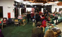 Families of deployed service members assigned to units at Ramstein Air Base congregate and socialize with one another at J.R. Rockers on Ramstein Air Base, Dec. 15, 2017. The 86 Airlift Wing Airman and Family Readiness Center hosts events for families of deployed loved ones once per month.