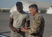 Chief Master Sgt. Joseph Montgomery, U.S. Air Forces Central Command chief, speaks with Airman 1st Class Carrolton Fernando’s, 380 Expeditionary Aircraft Maintenance Squadron fuel system technician, during his visit to the 380th Air Expeditionary Group at Al Dhafra Air Base, United Arab Emirates, Nov. 27, 2017. Chief Montgomery spoke about several topics including the Blended Retirement System and made sure the Airmen were prepared for the holidays. (U.S. Air National Guard photo by Staff Sgt. Colton Elliott)