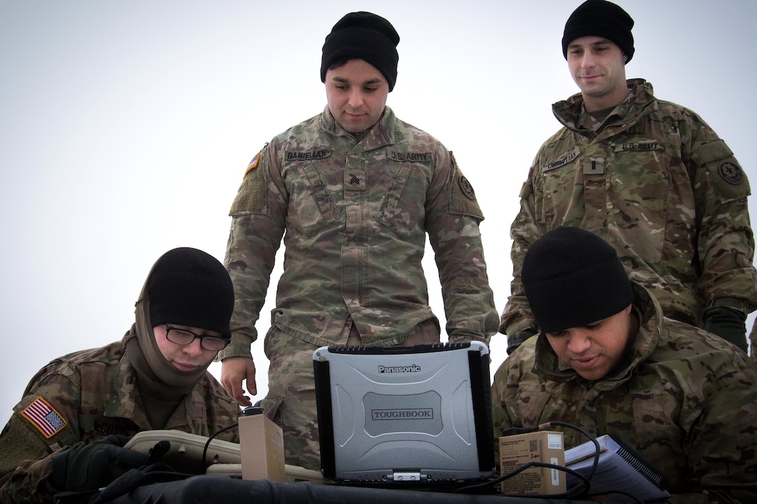 Soldiers perform a preflight checks on a Raven Unmanned Aerial Vehicle before conducting training.