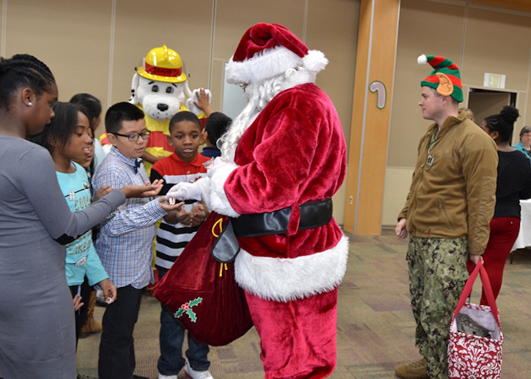 Santa passes out candy canes to students
