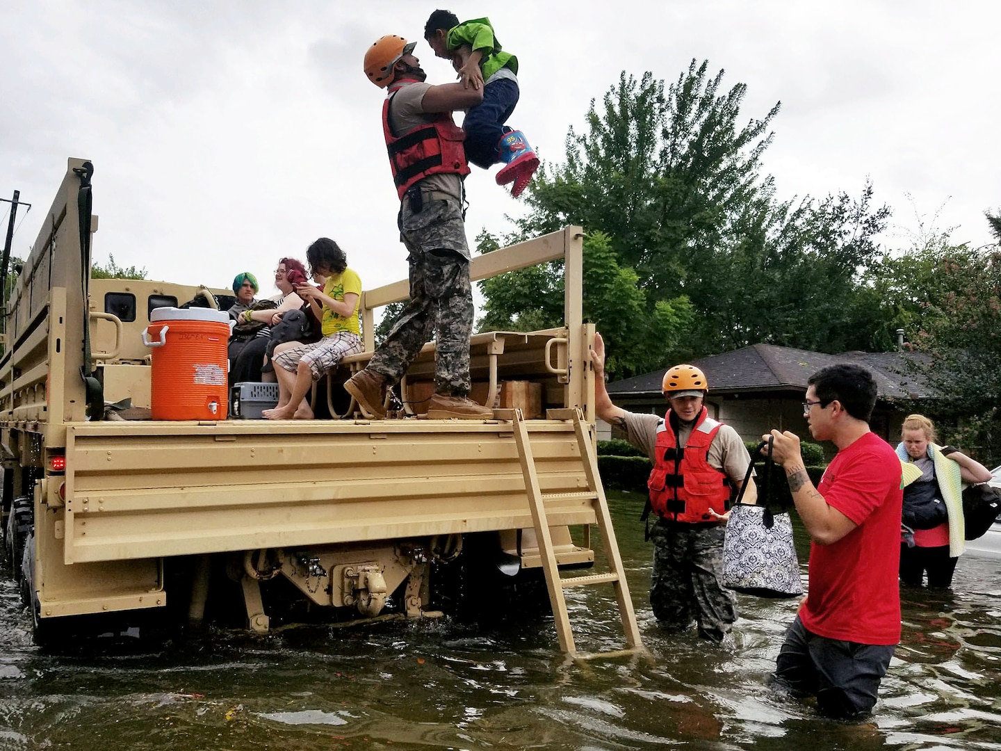 Members of the Texas National Guard in Houston  rescue stranded residents in flooded areas from the storms of Hurricane Harvey.