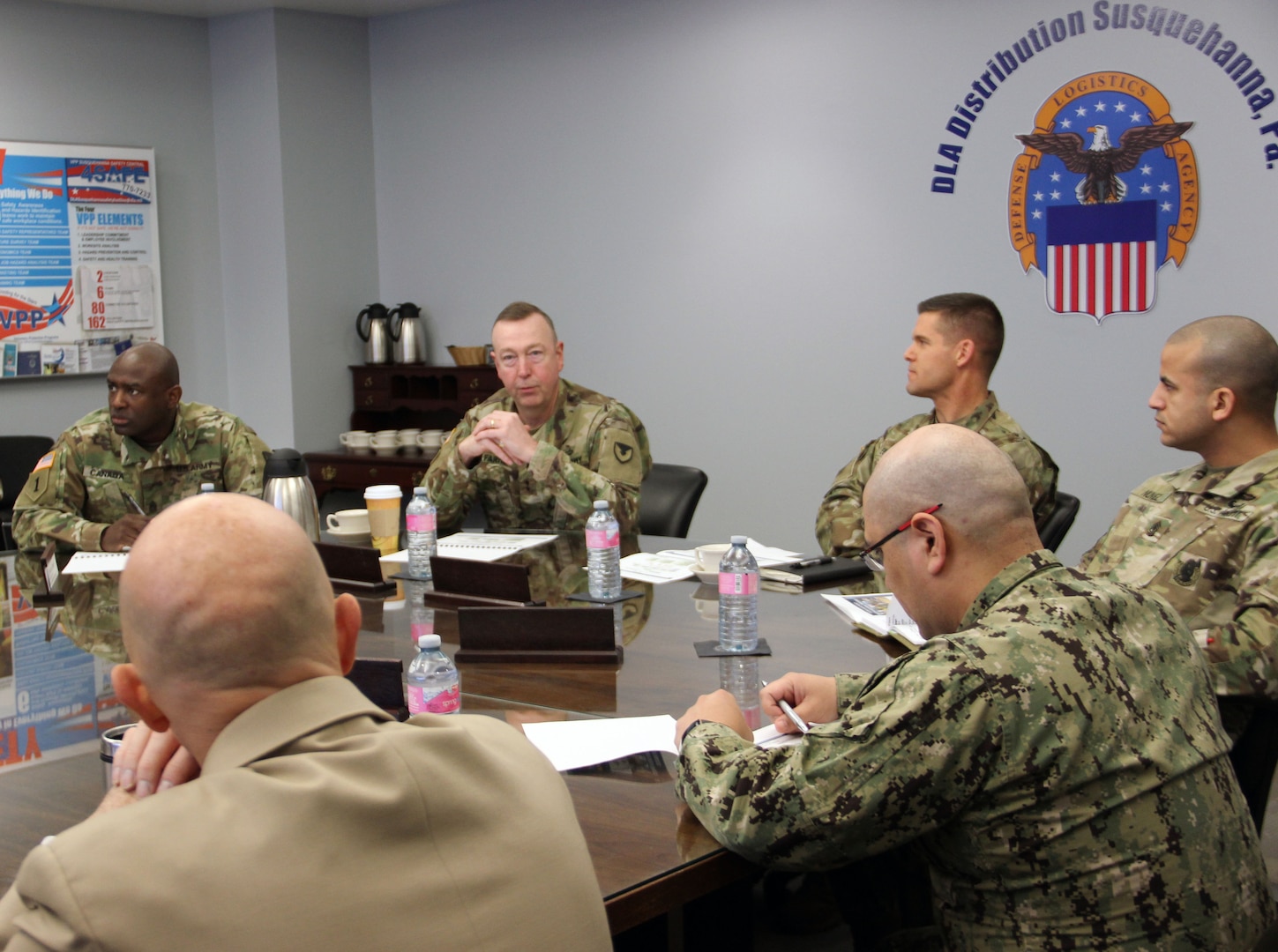 U. S. Army Security Assistance Command Commanding General, Maj. Gen. Stephen Farmen receives the DLA Distribution Command Presentation in building 2001 on December 15 in New Cumberland, Pennsylvania.