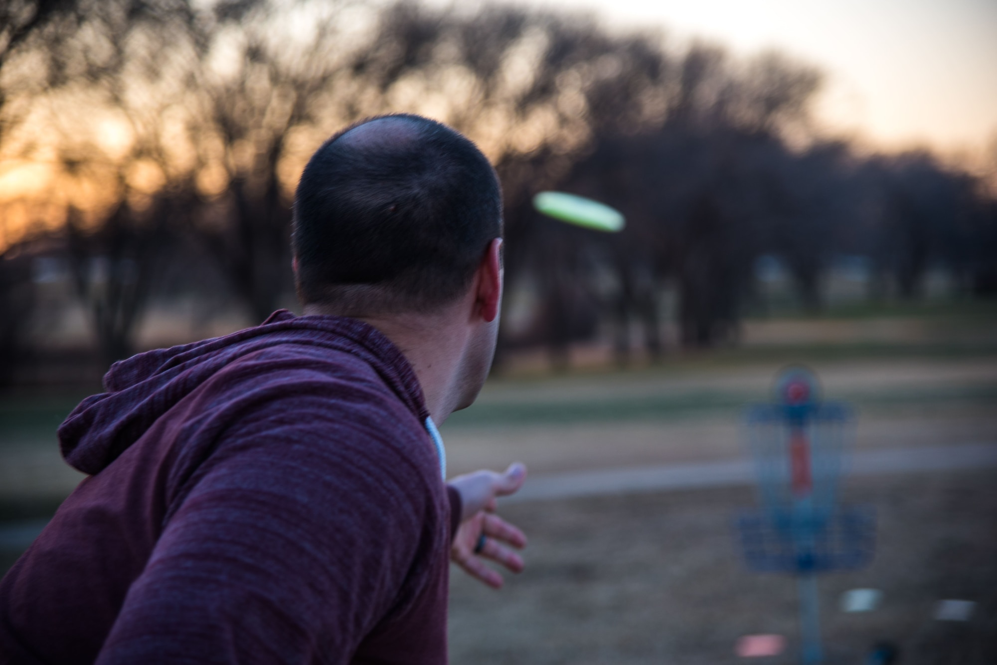 Staff Sgt. Michael Washburn, 27th Special Operations Wing Public Affairs photojournalist, throws a disc on the recently opened disc golf course at Cannon Air Force Base, N.M., on Dec. 13, 2017. The course has nine holes of varying distance, ranging from 100 to 250 meters. (U.S. Air Force photo by Airman 1st Class Vernon Walter)
