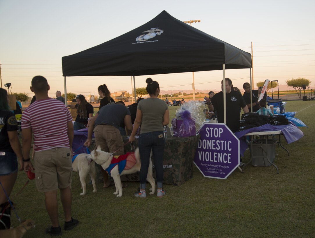 U.S. Marines, Sailors, and families attend Purple Paws for a Cause at Meyers Park on Marine Corps Air Station Yuma, Ariz., Oct. 6, 2017. Purple Paws for a Cause is an event hosted by the Family Advocacy Program that raises awareness of domestic violence and animal abuse. (U.S. Marine Corps photo by Lance Cpl. Sabrina Candiaflores)