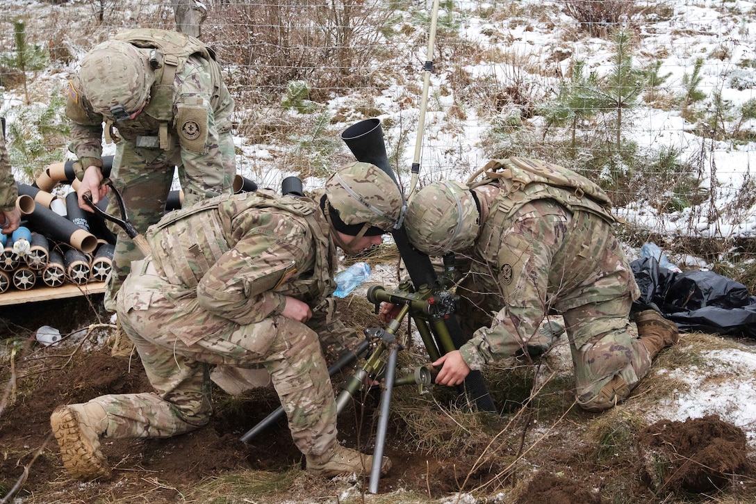 Soldiers sight in and adjust an 81-millimeter mortar