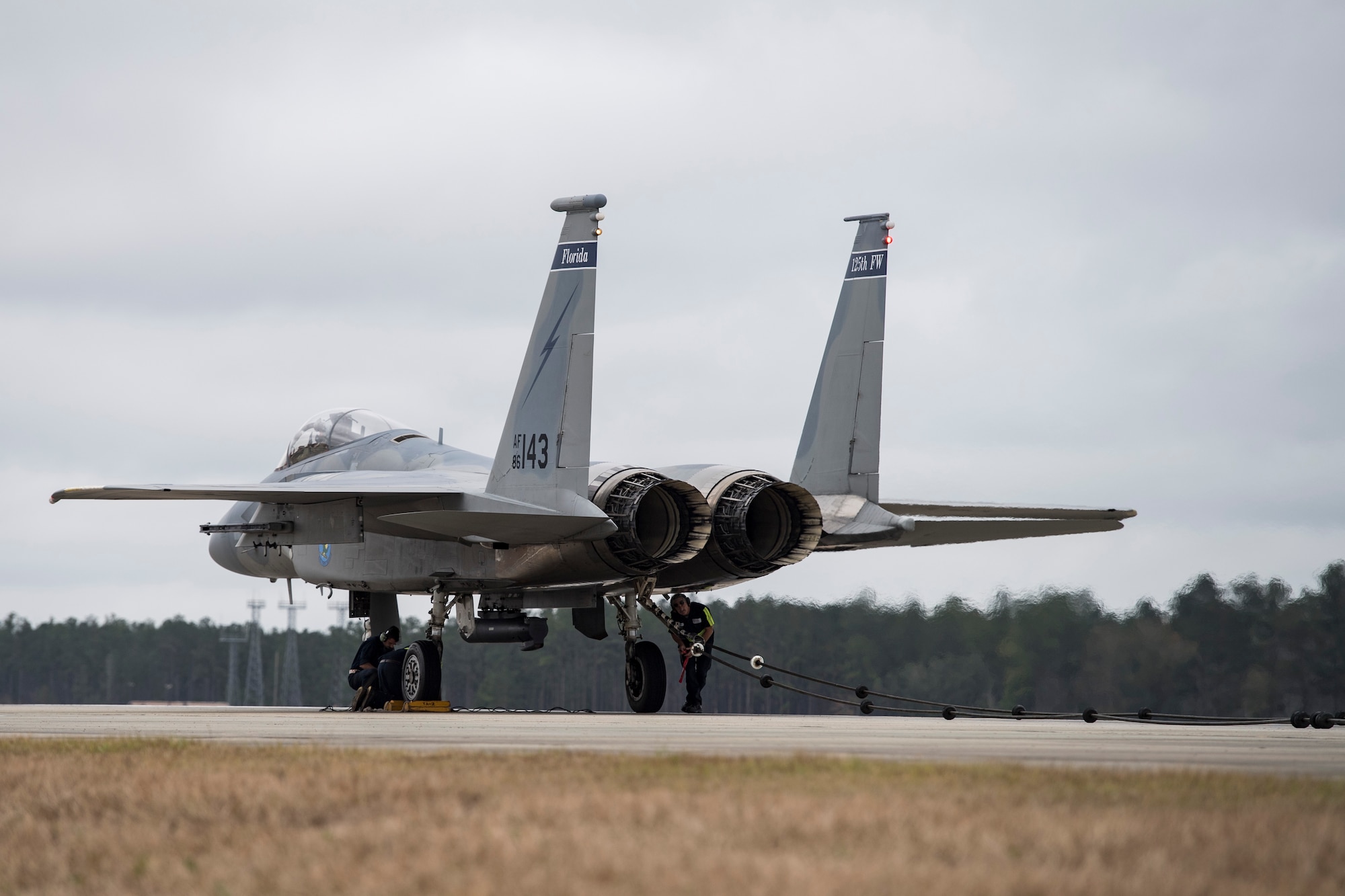 Crew chiefs prepare to release an F-15C Eagle from an arresting system, Dec. 19, 2017, at Moody Air Force Base, Ga. The BAK-12 arresting system is used on the runway to slow down fighter aircraft in emergency situations. The previous beam has been on Moody’s flightline since 1998, but under new guidelines will now be replaced every 10 years. (U.S. Air Force photo by Senior Airman Janiqua P. Robinson)