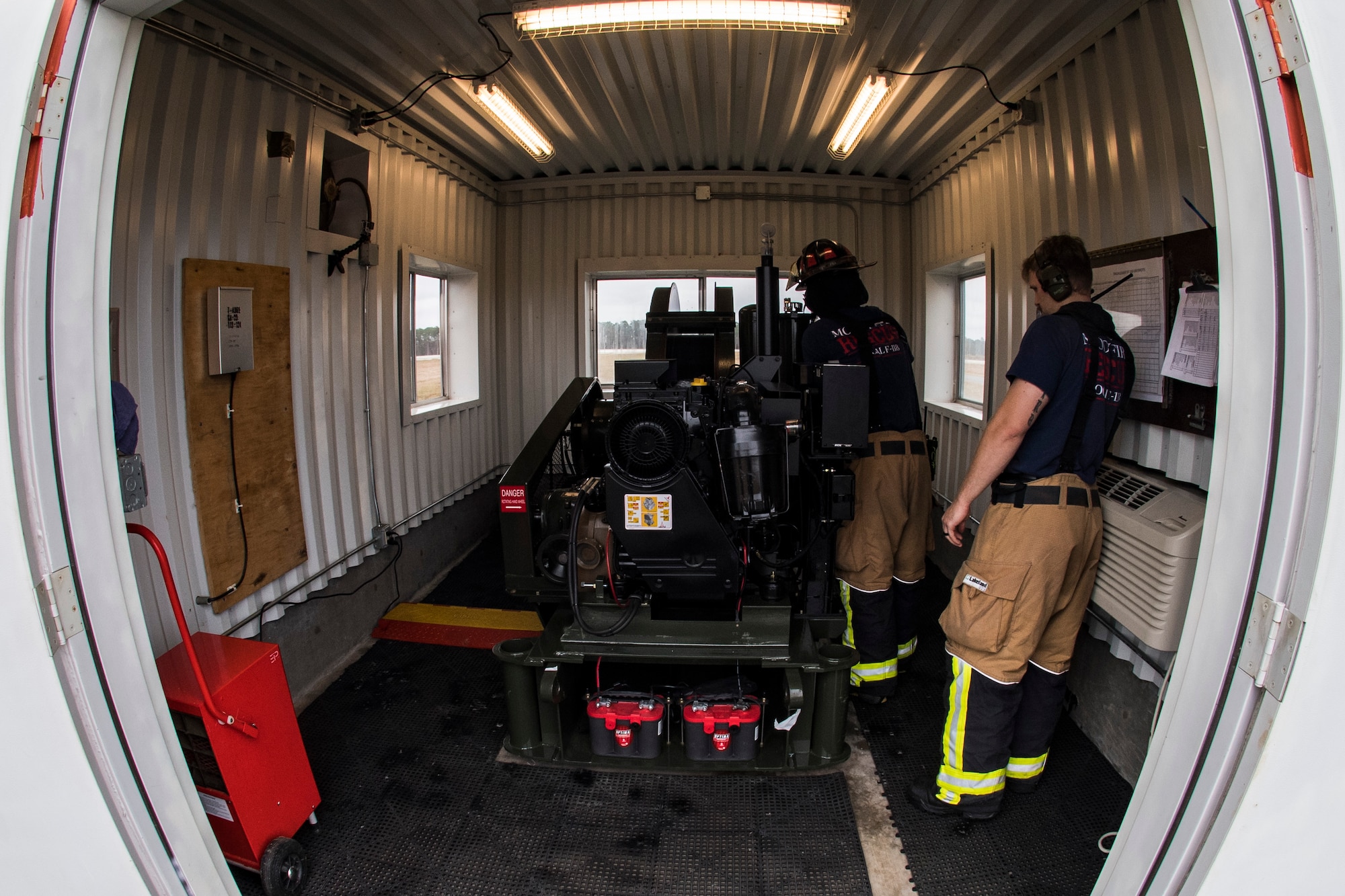 Airmen from the 23d Civil Engineer Squadron fire department prepare to release an F-15C Eagle from an arresting system, Dec. 19, 2017, at Moody Air Force Base, Ga. The BAK-12 arresting system is used on the runway to slow down fighter aircraft in emergency situations. The previous beam has been on Moody’s flightline since 1998, but under new guidelines will now be replaced every 10 years. (U.S. Air Force photo by Senior Airman Janiqua P. Robinson)