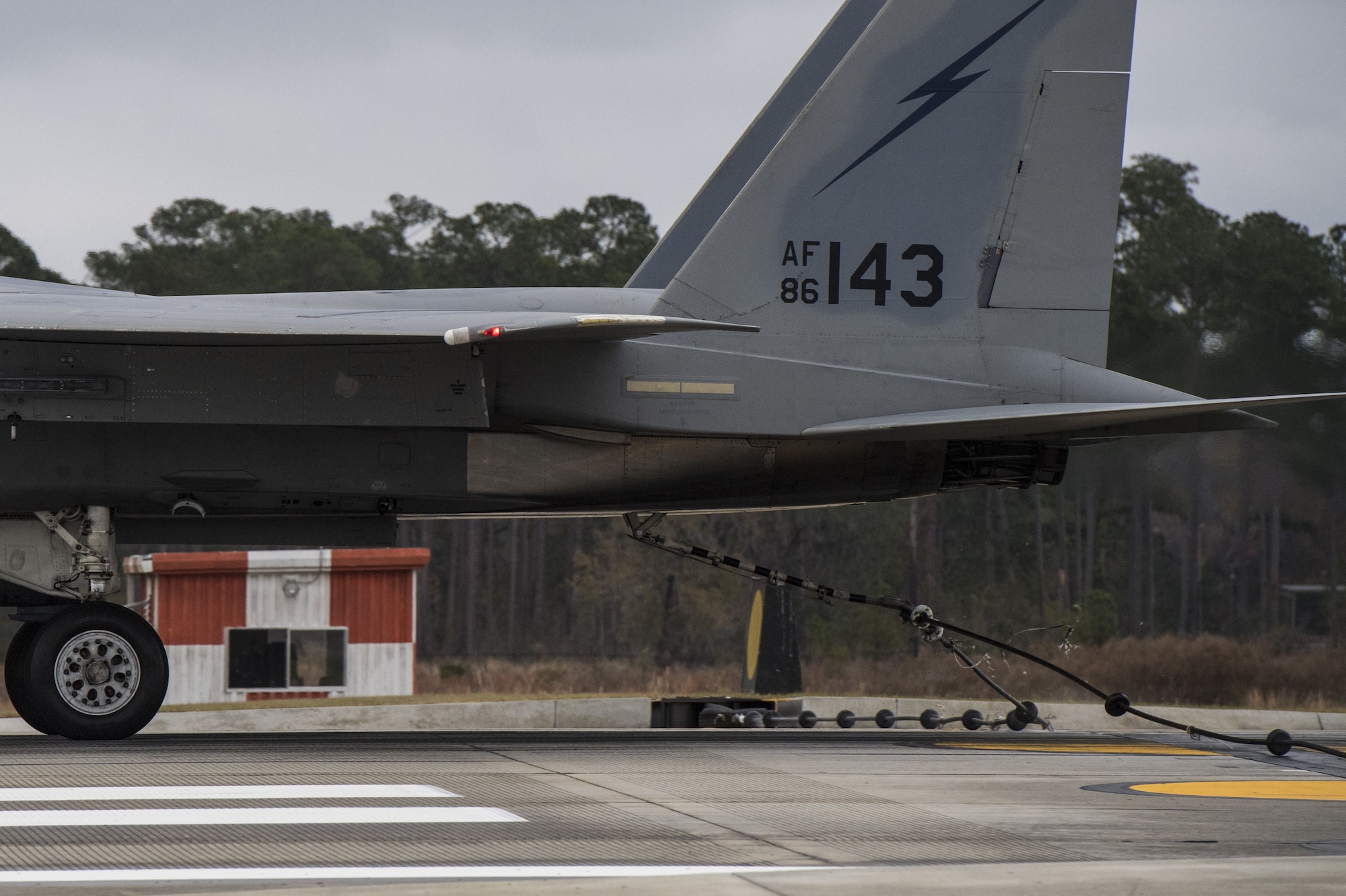 The tail hook on an F-15C Eagle catches the cable of an arresting system, Dec. 19, 2017, at Moody Air Force Base, Ga. The BAK-12 arresting system is used on the runway to slow down fighter aircraft in emergency situations. (U.S. Air Force photo by Senior Airman Janiqua P. Robinson)