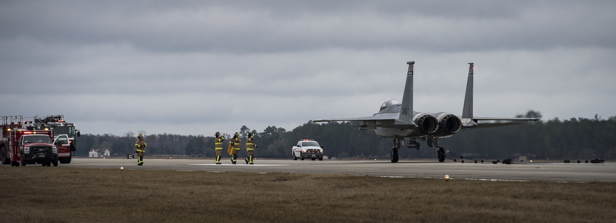 Airmen from the 23d Civil Engineer Squadron prepare to release an F-15C Eagle from an arresting system, Dec. 19, 2017, at Moody Air Force Base, Ga. The BAK-12 arresting system is used on the runway to slow down fighter aircraft in emergency situations. The previous beam has been on Moody’s flightline since 1998, but under new guidelines will now be replaced every 10 years. (U.S. Air Force photo by Senior Airman Janiqua P. Robinson)