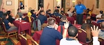 Navy veteran Michael Lindsey, a facilitator assigned to the Navy’s 21st Century Sailor office in Norfolk, Va., speaks with second class petty officers of Navy Recruiting District San Antonio about operational stress control during a district training meeting held at the Crowne Plaza Hotel in Austin Dec. 19. More than 250 recruiters, support personnel and their spouses attended the training where they were provided with support networks, programs, resources, training, and skills needed to overcome adversity and thrive.