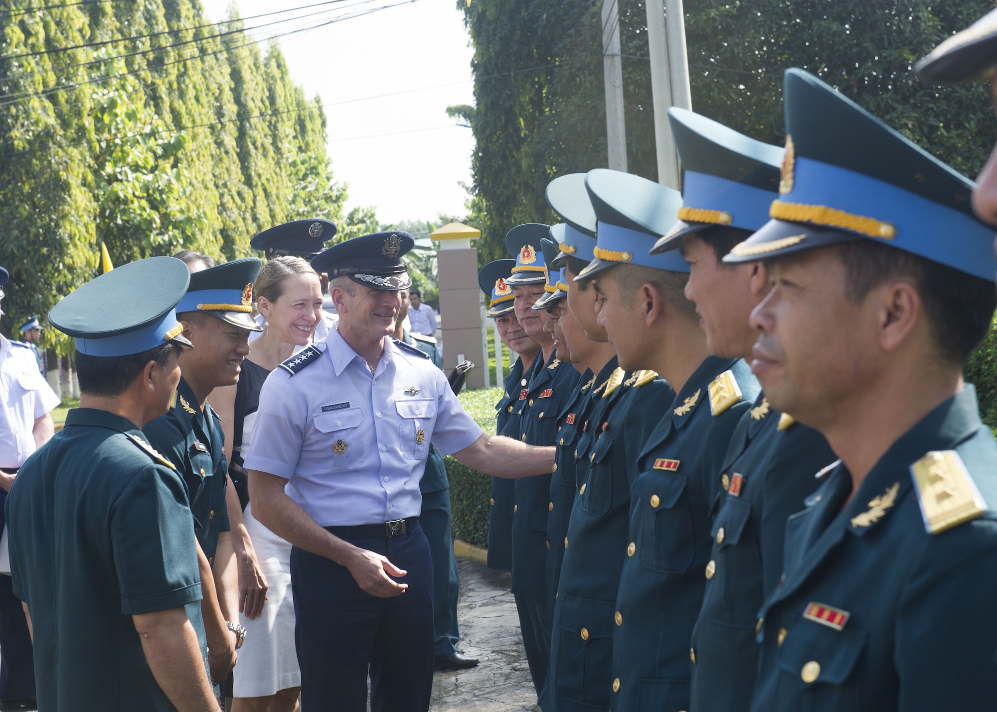 Vietnamese Air Defense-Force (ADAF) leadership greet Gen. Terrence J. O’Shaughnessy, Pacific Air Forces commander, during a visit to Bien Hoa Air Base, Vietnam, Dec. 16.