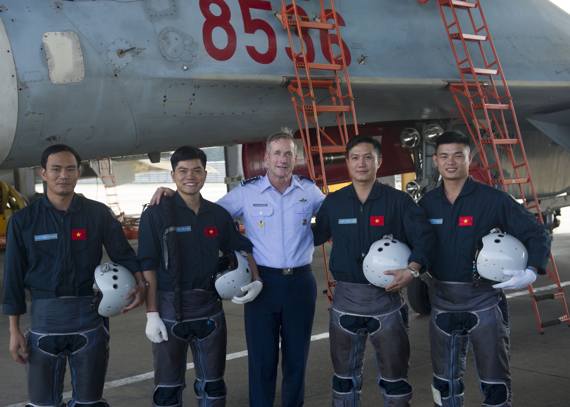 Gen. Terrence J. O’Shaughnessy, Pacific Air Forces commander, pose for a photo with Vietnamese Air Defense-Air Force (ADAF) pilots, during a visit to Bien Hoa Air Base, Vietnam, Dec. 16.