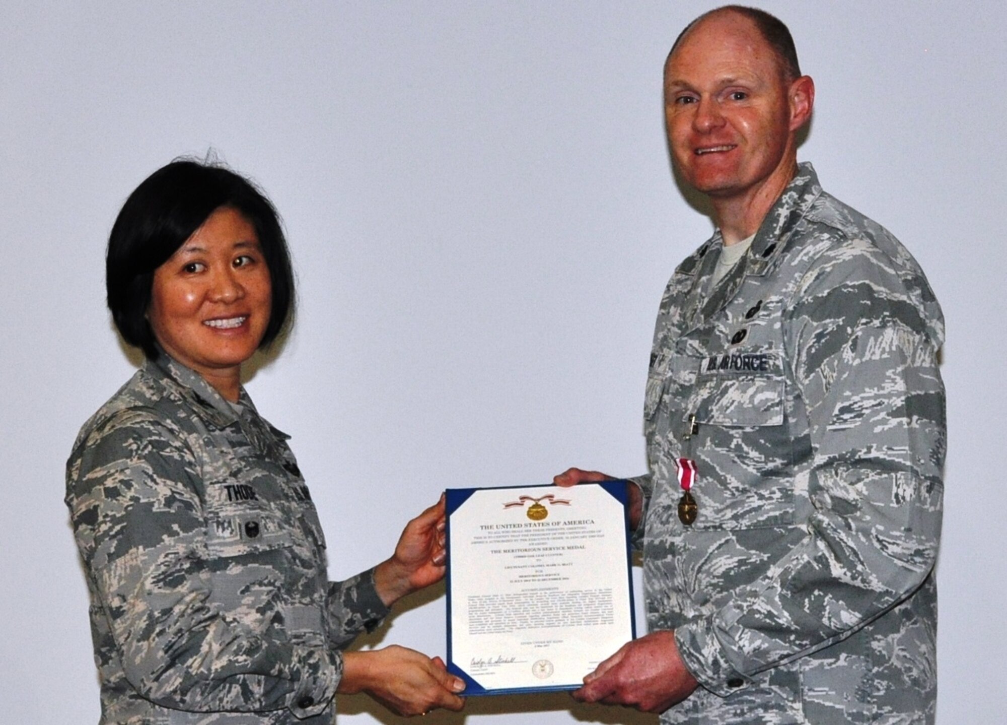 Col Janette Thode, 340th Flying Training Group commander, presents the Meritorious Service Medal to 340th FTG manpower and personnel director Lt. Col. Mark Hiatt during the December 2017 mandatory unit training assembly. (U.S. Air Force photo)