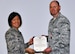 Col Janette Thode, 340th Flying Training Group commander, presents the Meritorious Service Medal to 340th FTG manpower and personnel director Lt. Col. Mark Hiatt during the December 2017 mandatory unit training assembly. (U.S. Air Force photo)