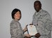 Col Janette Thode, 340th Flying Training Group commander, presents the Meritorious Service Medal to 340th FTG Comptroller Maj. Thallas Lumpkin during the December 2017 mandatory unit training assembly. (U.S. Air Force photo)