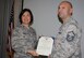 Col Janette Thode, 340th Flying Training Group commander, presents the Meritorious Service Medal to 340th FTG assistant force development NCOIC Master Sgt. Edwardo Morales. (U.S. Air Force photo)