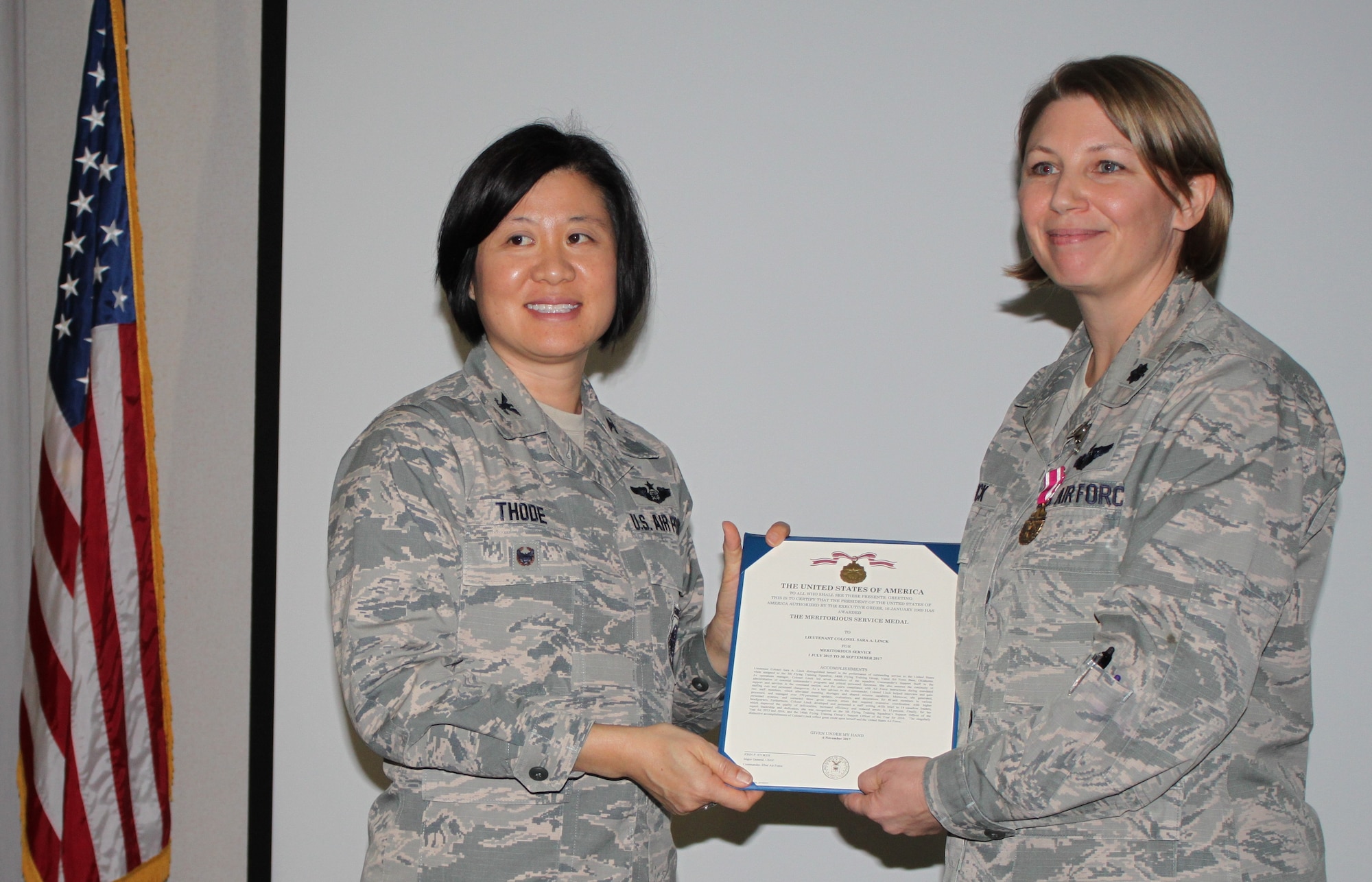 Col Janette Thode, 340th Flying Training Group commander, presents the Meritorious Service Medal to 340th FTG improvement process manager Lt. Col. Sara Linck during the December 2017 mandatory unit training assembly. (U.S. Air Force photo)