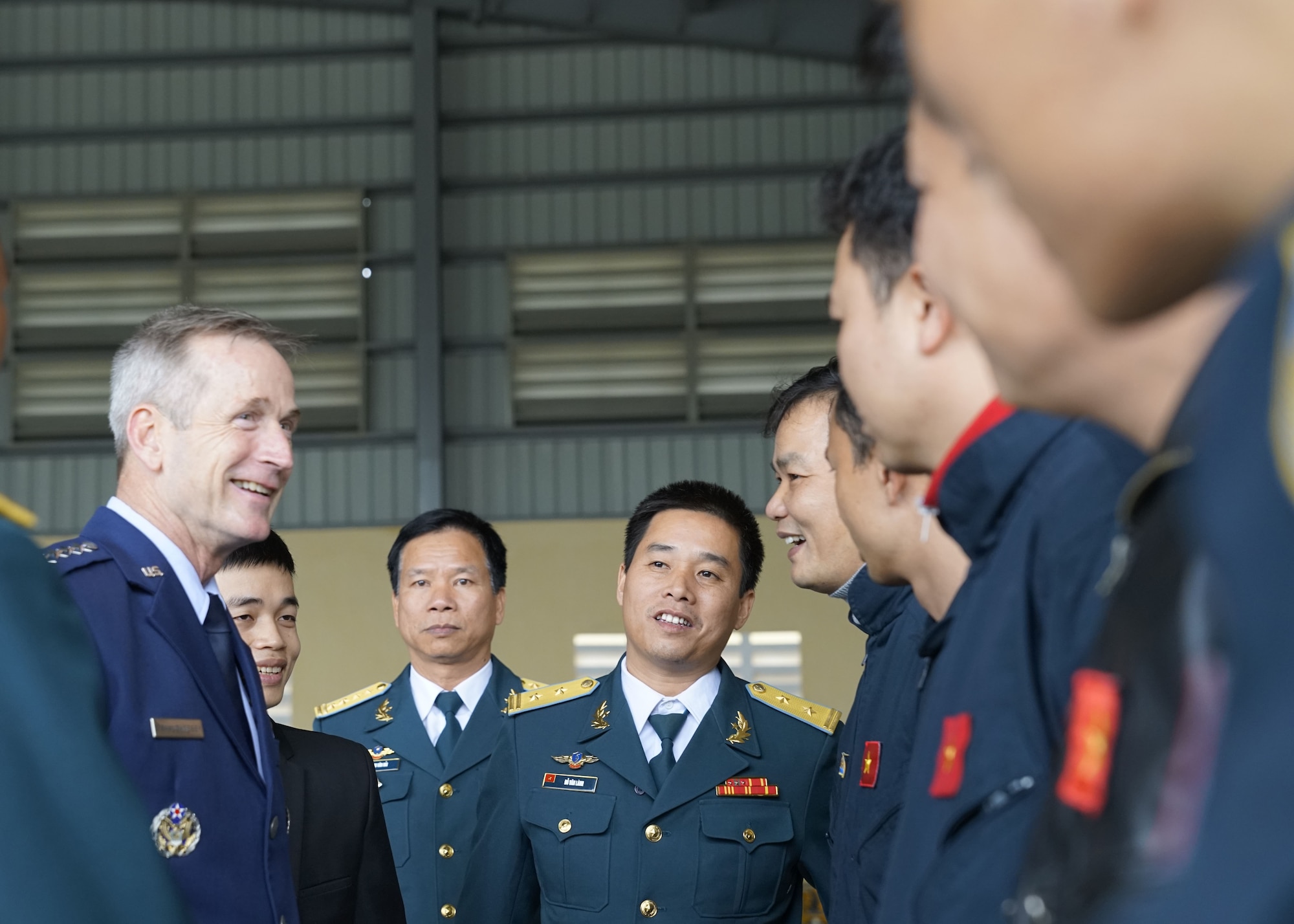 Gen. Terrence J. O’Shaughnessy, Pacific Air Forces commander, speaks with Vietnamese Air Defense-Air Force (ADAF) pilots during a base visit at Gia Lam Air Base, Vietnam, Dec. 14.