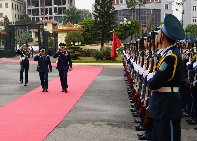 Gen. Terrence J. O’Shaughnessy, Pacific Air Forces commander and Senior Lt. Gen. Le Huy Vinh, Vietnamese Air Defense-Air Force commander, review a formation of ADAF Airmen prior to an office call at ADAF Headquarters, Hanoi, Vietnam, Dec. 14.