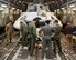 The Orion spacecraft Capsule Parachute Assembly System team pose for a photo before the mockup spacecraft is loaded onto a C-17 Globemaster III, Dec. 11, in Yuma, Arizona. (U.S. Air Force photo by Christopher A. Okula)