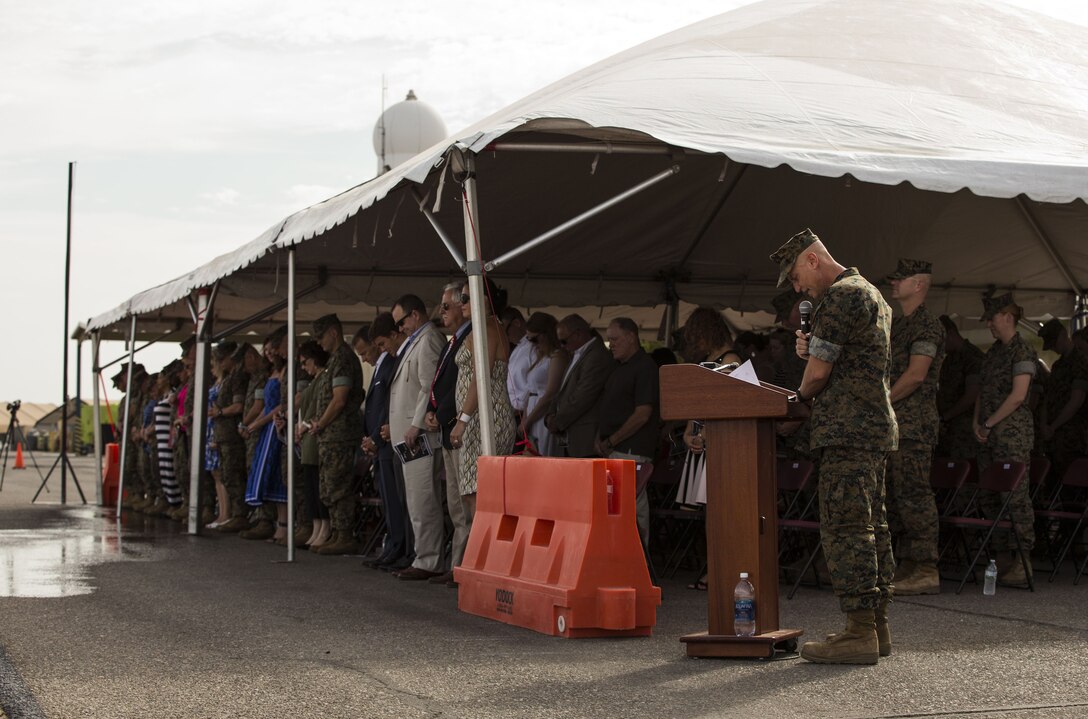 U.S. Navy Lt. Cmdr. Jeffrey Jenkins, the Marine Aircraft Group (MAG) 13 Chaplain, gives the invocation during the MAG-13 change of command ceremony on the flightline at Marine Corps Air Station Yuma, Ariz., July 28, 2017. Col. Marcus B. Annibale, the outgoing commanding officer of MAG-13, relinquished command to the oncoming commanding officer, Col. William R. Sauerland. (U.S. Marine Corps photo taken by Lance Cpl. Christian Cachola)