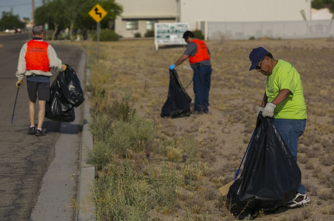 Volunteers from the Marine Corps Air Station Yuma Environmental Department participated in the roadside cleanup of Palo Verde Street, Monday, April 17, 2017 as a part of their Earth Week events. MCAS Yuma adopted this street over 17 years ago, and has helped keep it clean it each year. (U.S. Marine Corps photo taken by Lance Cpl. Isaac D. Martinez/Released)