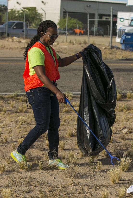 Volunteers from the Marine Corps Air Station Yuma Environmental Department participated in the roadside cleanup of Palo Verde Street, Monday, April 17, 2017 as a part of their Earth Week events. MCAS Yuma adopted this street over 17 years ago, and has helped keep it clean it each year. (U.S. Marine Corps photo taken by Lance Cpl. Isaac D. Martinez/Released)