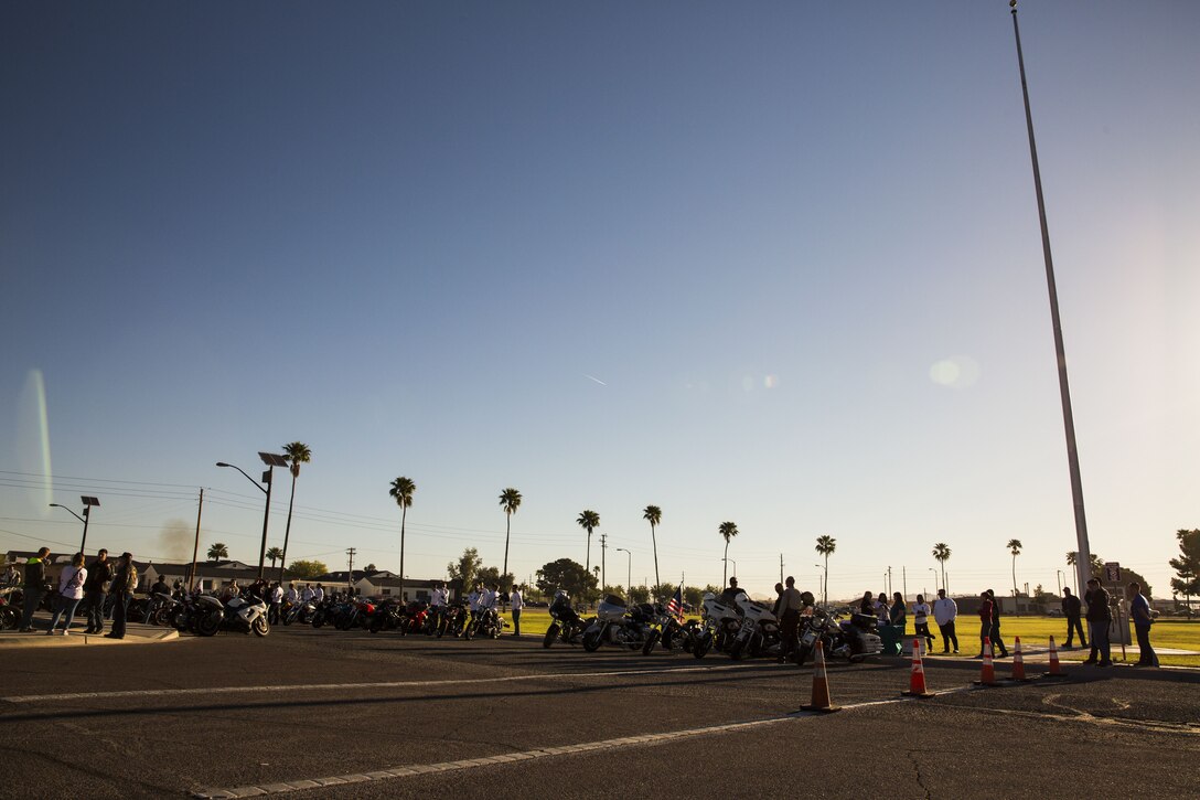 Service members, veterans, retirees and local law enforcement personnel gather in front of the Marine Corps Air Station Yuma parade deck during the 5th Annual Sexual Assault Awareness and Response Motorcycle Ride at Marine Corps Air Station Yuma, Ariz., Thursday, April 6, 2017. The motorcycle ride promotes Sexual Assault Awareness Month, raises awareness of the Sexual Assault Prevention and Response (SAPR) Program, and its resources available at MCAS Yuma. The event also supports Amberly’s Place, an organization that provides services to victims and their families. (U.S. Marine Corps photo taken by Lance Cpl. Christian Cachola)