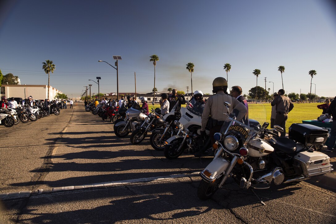 Service members, veterans, retirees and local law enforcement personnel prepare their vehicles during the 5th Annual Sexual Assault Awareness and Response Motorcycle Ride at Marine Corps Air Station Yuma, Ariz., Thursday, April 6, 2017. The motorcycle ride promotes Sexual Assault Awareness Month, raises awareness of the Sexual Assault Prevention and Response (SAPR) Program, and its resources available at MCAS Yuma. The event also supports Amberly’s Place, an organization that provides services to victims and their families. (U.S. Marine Corps photo taken by Lance Cpl. Christian Cachola)