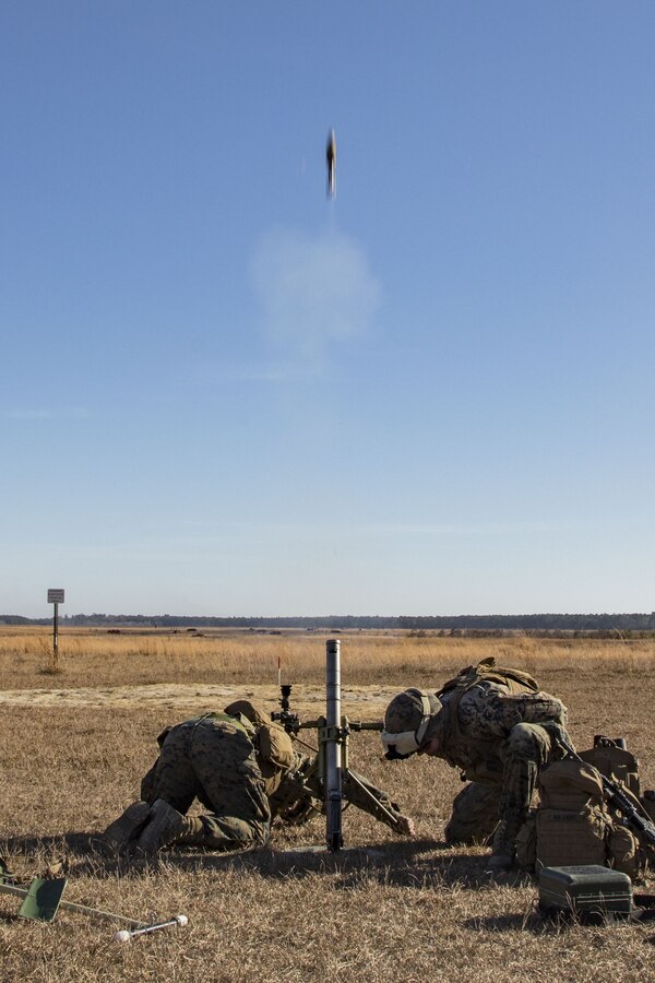 Marines with fire a M224 60mm mortar system during a live-fire mortar range at Camp Lejeune, N.C., Dec. 19, 2017. The unit used the hand held, direct lay and direct alignment methods to engage targets 1,500 meters away. This provided Marines with India Company, 3rd Battalion, 6th Marine Regiment, 2nd Marine Division the opportunity to increase their proficiency and familiarization with the weapon system. (U.S. Marine Corps photo by Cpl. Aaron Henson)