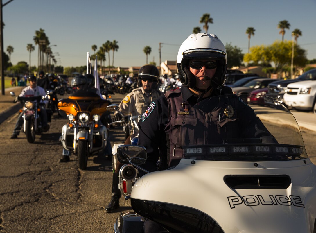 A policeman assigned to the Yuma Police Department leads the first group of motorcyclists during the 5th Annual Sexual Assault Awareness and Response Motorcycle Ride at Marine Corps Air Station Yuma, Ariz., Thursday, April 6, 2017. The motorcycle ride promotes Sexual Assault Awareness Month, raises awareness of the Sexual Assault Prevention and Response (SAPR) Program, and its resources available at MCAS Yuma. The event also supports Amberly’s Place, an organization that provides services to victims and their families. (U.S. Marine Corps photo taken by Lance Cpl. Christian Cachola)