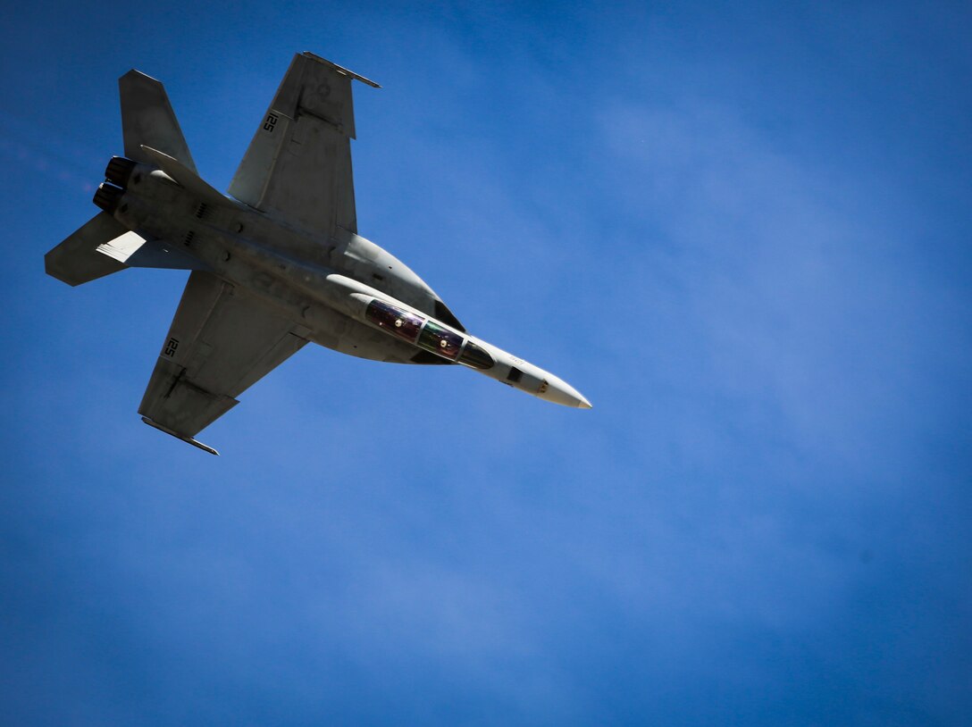 A U.S. Navy F/A-18E Super Hornet with Strike Fighter Squadron 122 (VFA-122) performs a tactical demonstration, showcasing the aircraft's high speed manuverability and low speed handling characteristics, as part of the 2017 Yuma Airshow at Marine Corps Air Station Yuma, Ariz., Saturday, March 18, 2017. (U.S. Marine Corps photo taken by Sgt. Travis Gershaneck)