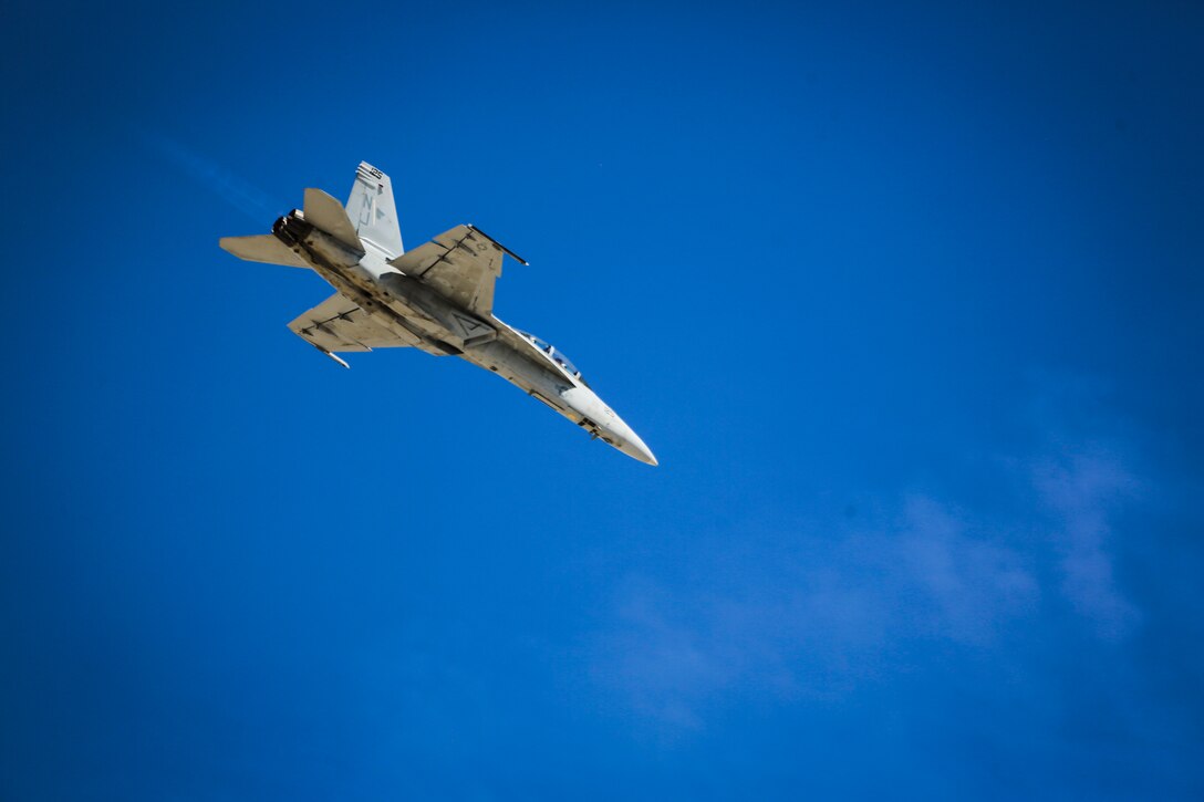 A U.S. Navy F/A-18E Super Hornet with Strike Fighter Squadron 122 (VFA-122) performs a tactical demonstration, showcasing the aircraft's high speed manuverability and low speed handling characteristics, as part of the 2017 Yuma Airshow at Marine Corps Air Station Yuma, Ariz., Saturday, March 18, 2017. (U.S. Marine Corps photo taken by Sgt. Travis Gershaneck)