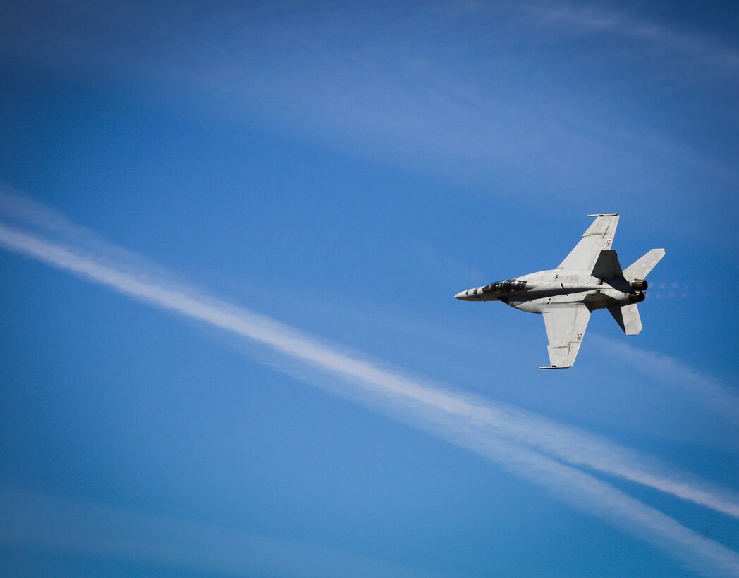 A U.S. Navy F/A-18E Super Hornet with Strike Fighter Squadron 122 (VFA-122) performs a tactical demonstration, showcasing the aircraft's high speed manuverability and low speed handling characteristics, as part of the 2017 Yuma Airshow at Marine Corps Air Station Yuma, Ariz., Saturday, March 18, 2017. (U.S. Marine Corps photo taken by Sgt. Travis Gershaneck)