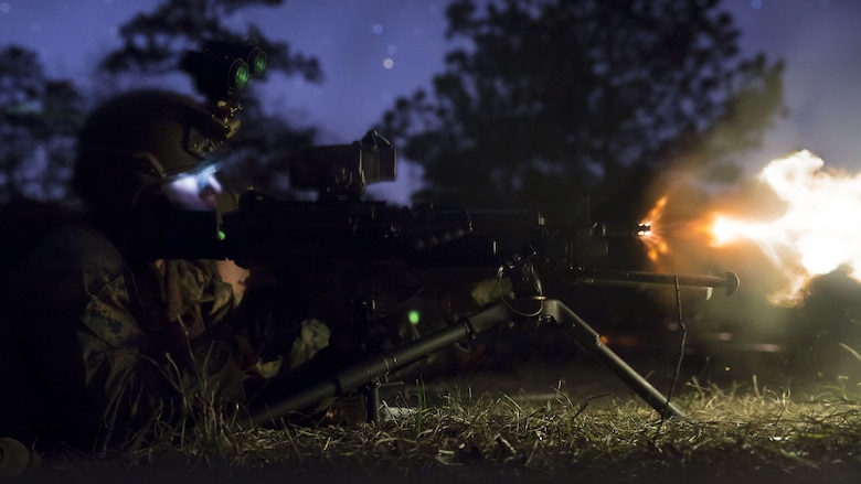 A Marine with 2nd Reconnaissance Battalion fires an M249 light machine gun during a night shoot at Fort Stewart, Ga., Dec. 10, 2017. The Marines practiced different shooting drills and used fire and maneuver, as well as supportive fire positions to sharpen their marksmanship and ability to work cohesively with their squads. The range was part of a pre-deployment training exercise designed to prepare the Recon Marines for future operations.  (U.S. Marine Corps photo by Lance Cpl. Taylor W. Cooper)