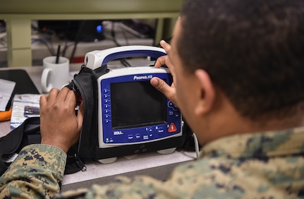 U.S. Navy Hospitalman 2nd Class Antwon Cox, 4th Medical Logistics Company, tests an electrocardiogram at Joint Base Charleston, S.C., Dec. 12, 2017.