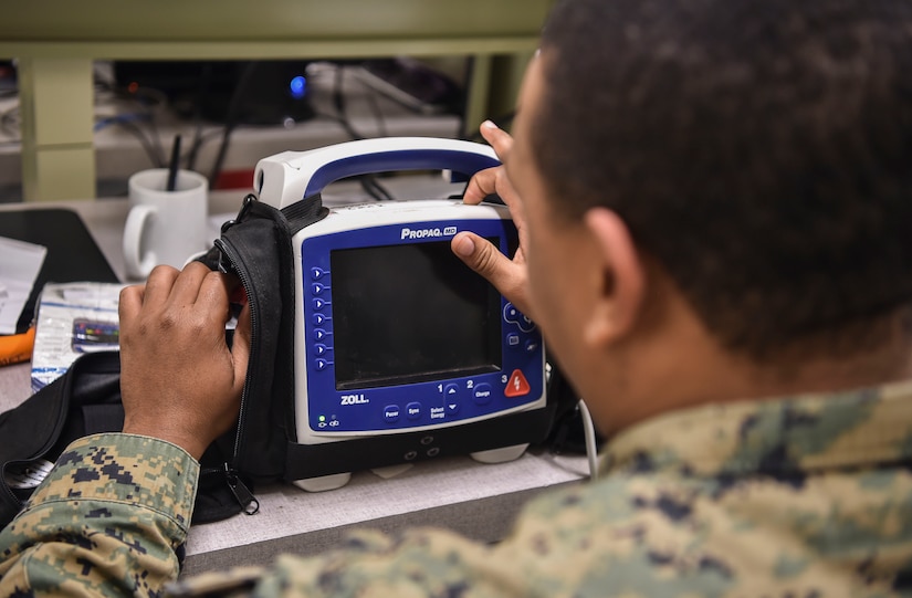 U.S. Navy Hospitalman 2nd Class Antwon Cox, 4th Medical Logistics Company, tests an electrocardiogram at Joint Base Charleston, S.C., Dec. 12, 2017.