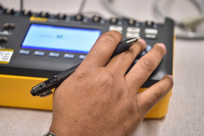 U.S. Navy Hospitalman 2nd Class Antwon Cox, 4th Medical Logistics Platoon, tests an electrocardiogram at Joint Base Charleston, S.C., Dec. 12, 2017.