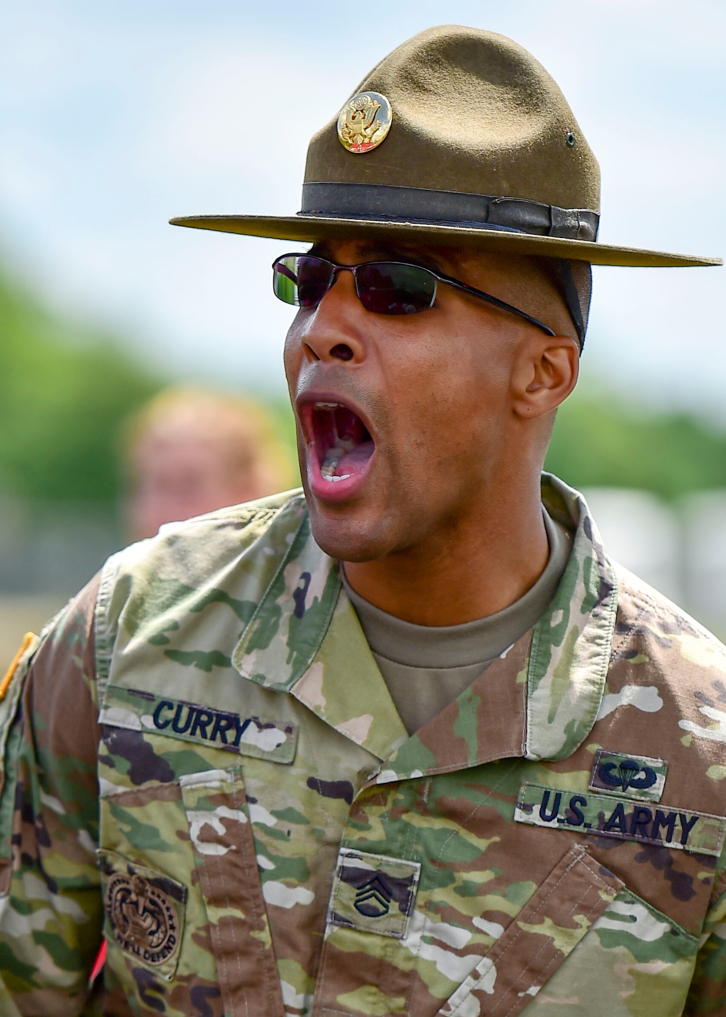 U.S. Army Staff Sgt. Brandon Curry, a drill sergeant with the 1st Bn., 390th Inf. Reg., yells orders to Junior Reserve Officer Training Corps (JROTC) cadets during an encampment here, June 21, 2017.