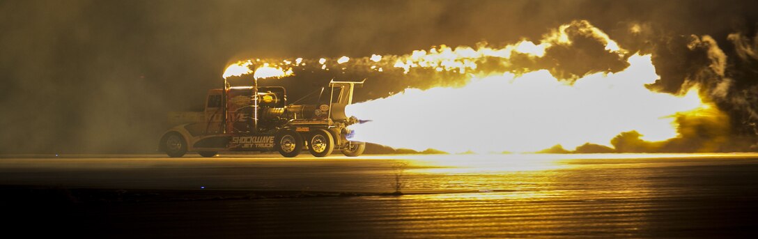 The Shockwave Jet Truck makes a high speed pass down the flight line using its jet propulsion system during the 2017 Twilight Show, Friday, March 17, 2017 at Marine Corps Air Station Yuma, Ariz. (U.S. Marine Corps photo taken by Lance Cpl. Isaac Martinez)