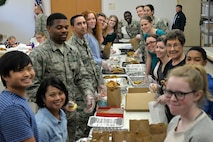 Volunteers prepare bags of cookies at the Taylor Chapel on Goodfellow Air Force Base, Texas, for distribution to Goodfellow trainees Dec. 20, 2017. The volunteers also prepared large cookie trays for various events and activities around the base for the next week.