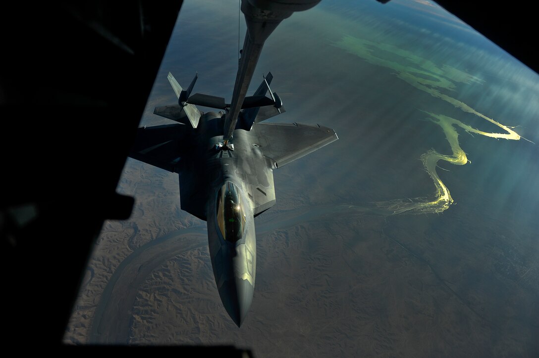 An F-22 assigned to the 380th Air Expeditionary Wing, Al Dhafra Air Base, United Arab Emirates receives fuel over Iraq [Euphrates River] from a KC-10 Extender, Nov. 29, 2017. The F-22 is a component of the Global Strike Task Force, supporting U.S. and Coalition forces working to liberate territory and people under the control of ISIS. 
 (U.S. Air Force photo by Tech. Sgt. Anthony Nelson Jr.)