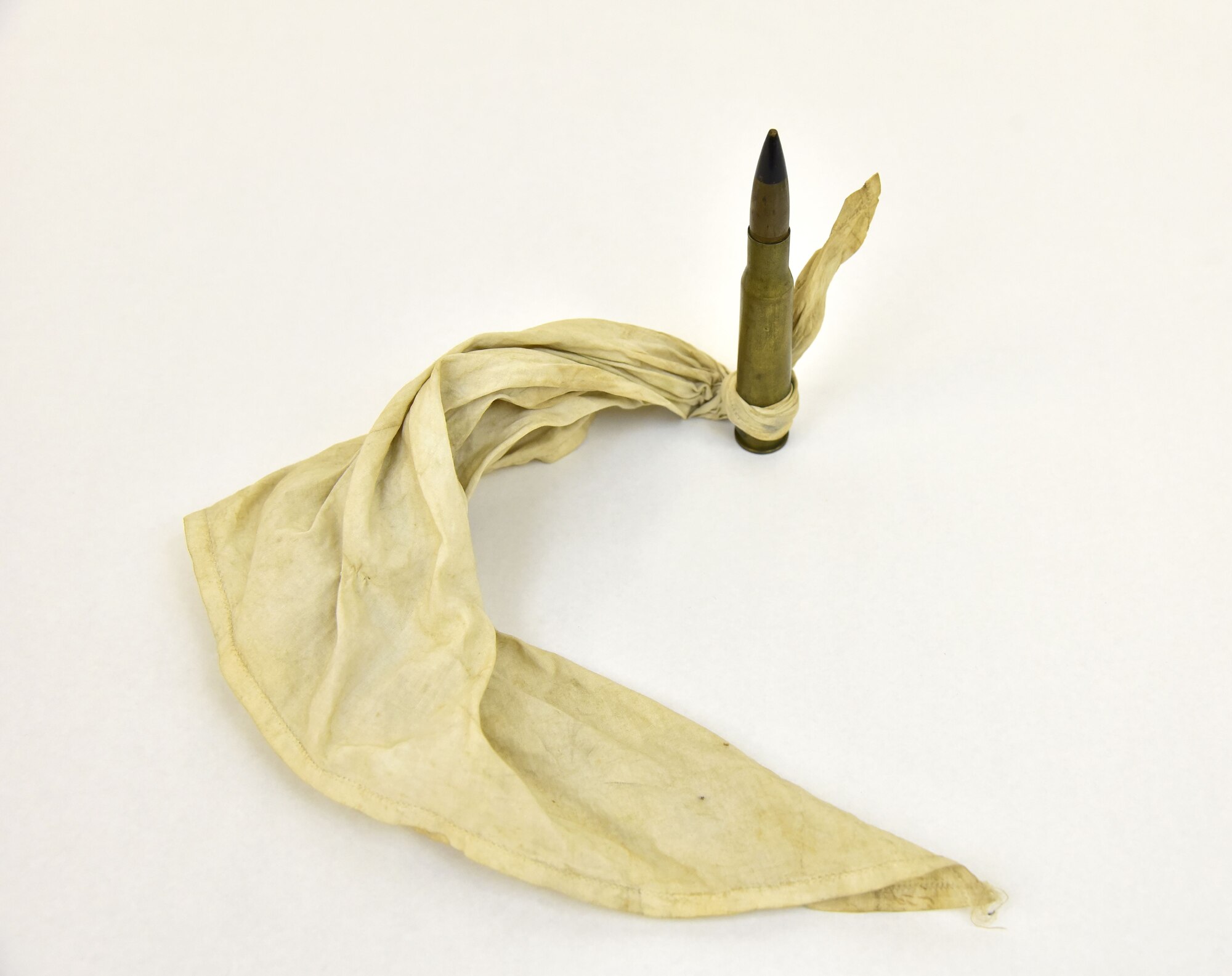 Plans call for this artifact to be displayed near the B-17F Memphis Belle™ as part of the new strategic bombardment exhibit in the WWII Gallery, which opens to the public on May 17, 2018. B-17 pilot Lawrence Dwyer celebrated his last mission on May 14, 1943 by dropping this bullet tied to a handkerchief over his airfield.
