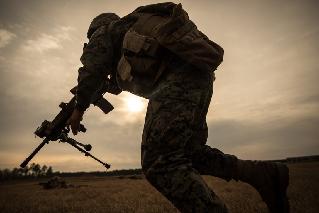A U.S. Marine with Delta Company, Infantry Training Battalion (ITB), School of Infantry-East, maneuvers to his postion during a combined arms exercise at Camp Lejeune, N.C., Dec. 15, 2017. The mission of ITB is to train Marines in basic infantry skills before integrating into the operational forces.