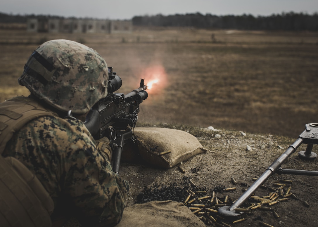 A U.S. Marine assigned to Delta Company, Infantry Training Battalion, School of Infantry-East, fires an M240B machine gun during a combined arms exercise at Camp Lejeune, N.C., Dec. 15, 2017. The combined arms exercise allowed riflemen and machine gunners to work together by closing with and destroying targets by fire and maneuver.
