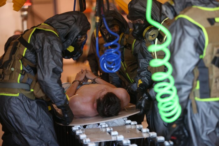 During the week-long training the platoons refined their skills in setup and breakdown of decontamination sites, decontamination of role players, and identification and detection of known agents in several scenarios including mass casaulty, radiation scenario and a subway scenario.  (Official USMC Photos by Staff Sgt. Santiago G. Colon Jr.)