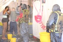 During the week-long training the platoons refined their skills in setup and breakdown of decontamination sites, decontamination of role players, and identification and detection of known agents in several scenarios including mass casaulty, radiation scenario and a subway scenario.  (Official USMC Photos by Staff Sgt. Santiago G. Colon Jr.)